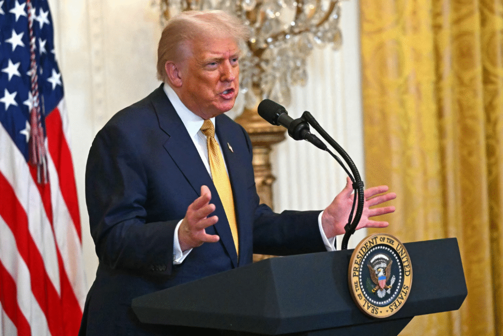 Trump AI Action Plan 2025: Trump speaking behind a lectern with presidential seal, signaling official policy launch